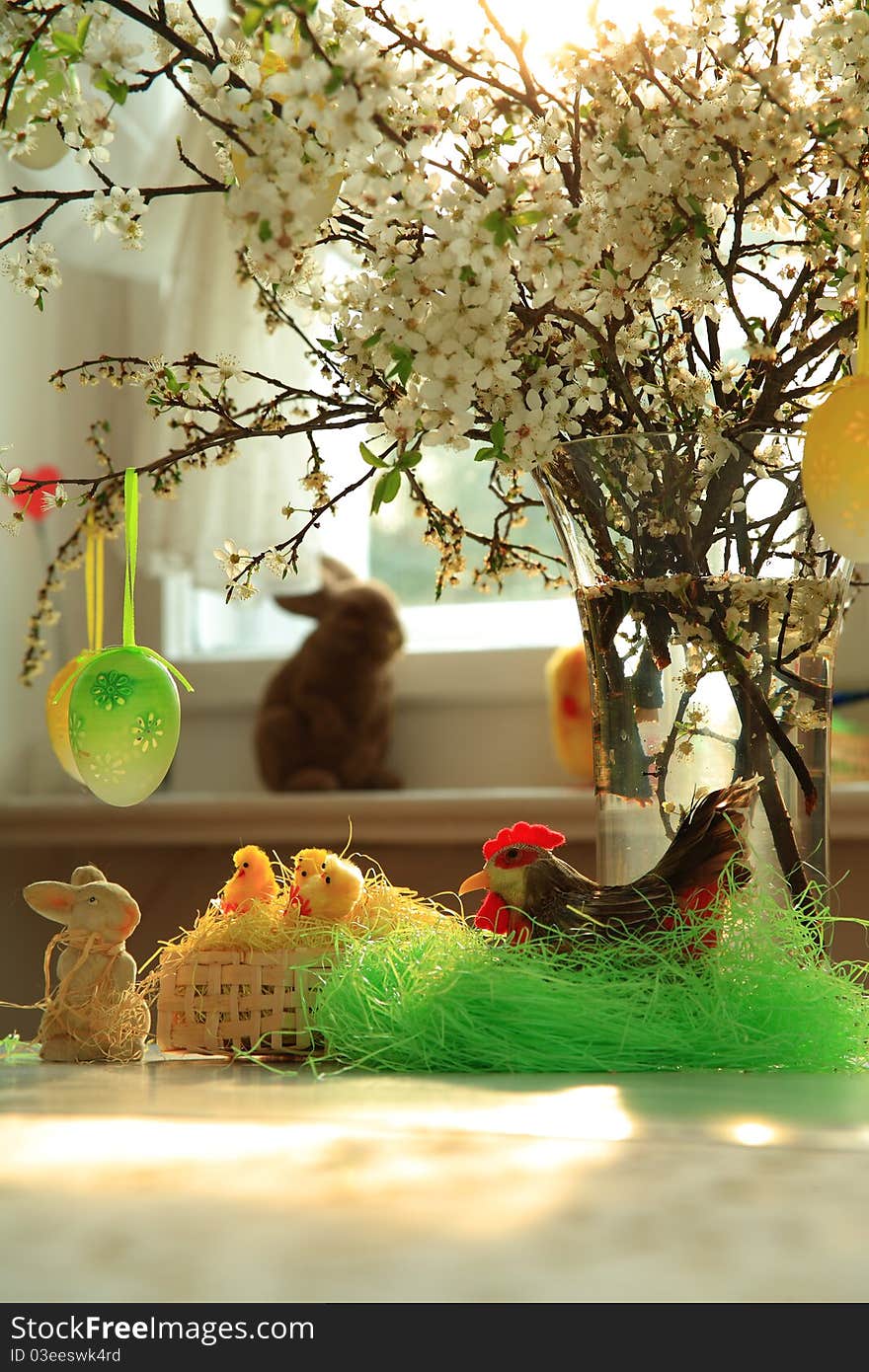 Spring flowers in glass, easter bunny and little chickens in basket . Spring flowers in glass, easter bunny and little chickens in basket .