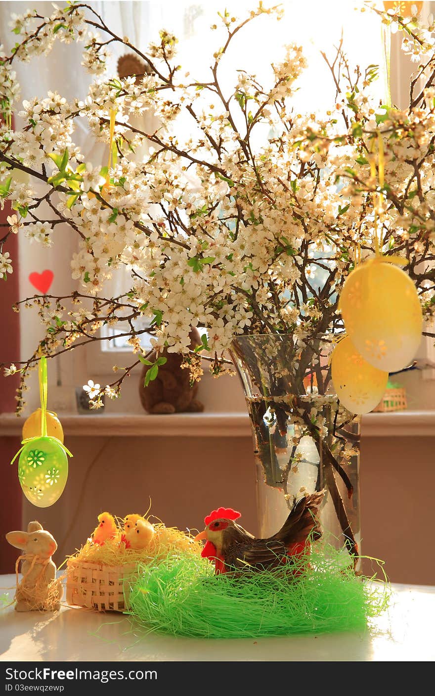 Spring flowers in glass, easter bunny and little chickens in basket . Spring flowers in glass, easter bunny and little chickens in basket .