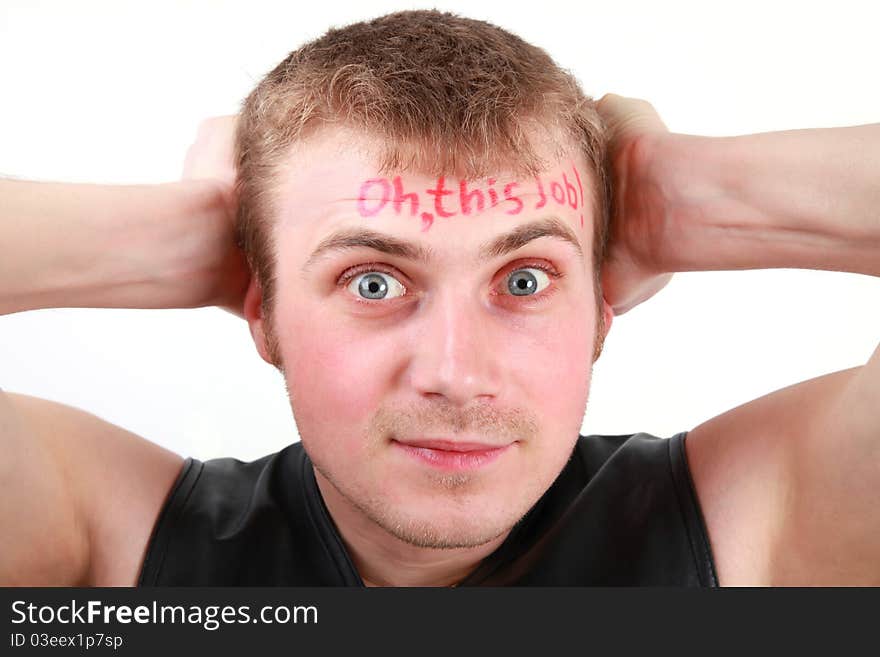 Portrait of a young man with a sign Oh, this job! written on his forehead. Portrait of a young man with a sign Oh, this job! written on his forehead.