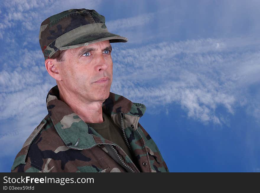 Middle aged army veteran looking up into the distance. Middle aged army veteran looking up into the distance.