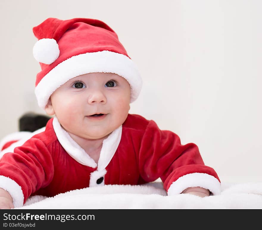 Baby boy wearing santa's costume. Baby boy wearing santa's costume