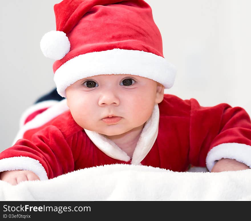 Cute baby boy wearing santa's costume. Cute baby boy wearing santa's costume