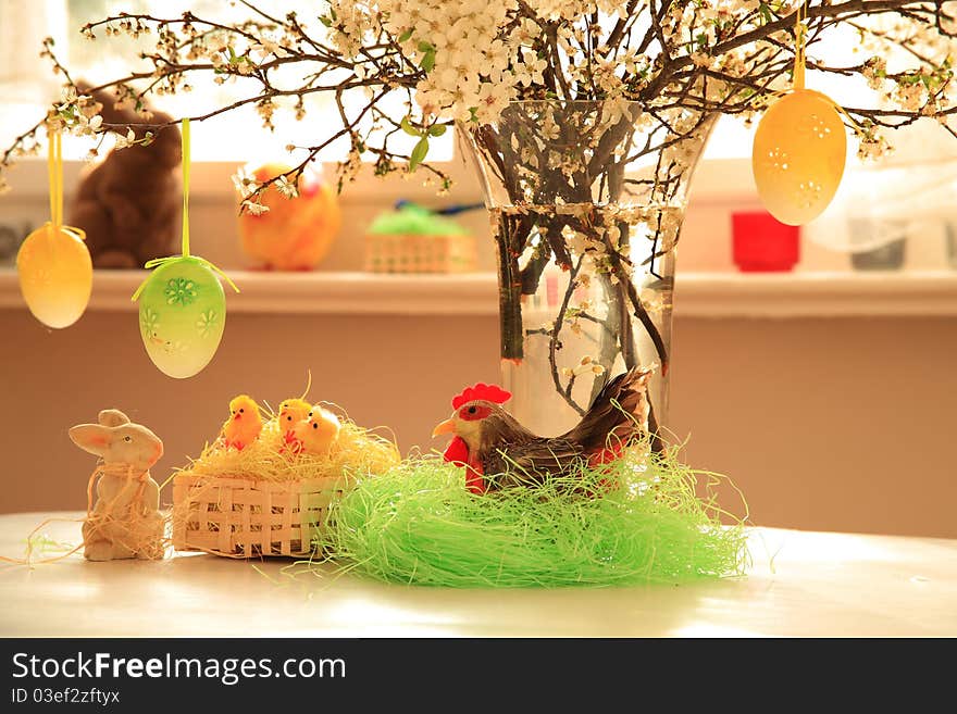 Spring flowers in glass, easter bunny and little chickens in basket . Spring flowers in glass, easter bunny and little chickens in basket .