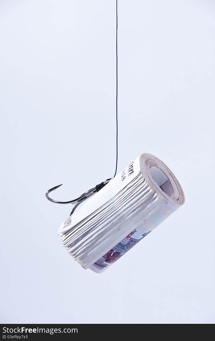 Twisting banknotes hanging on a hook