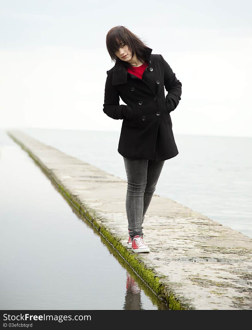 Young teen girl at outdoor near water