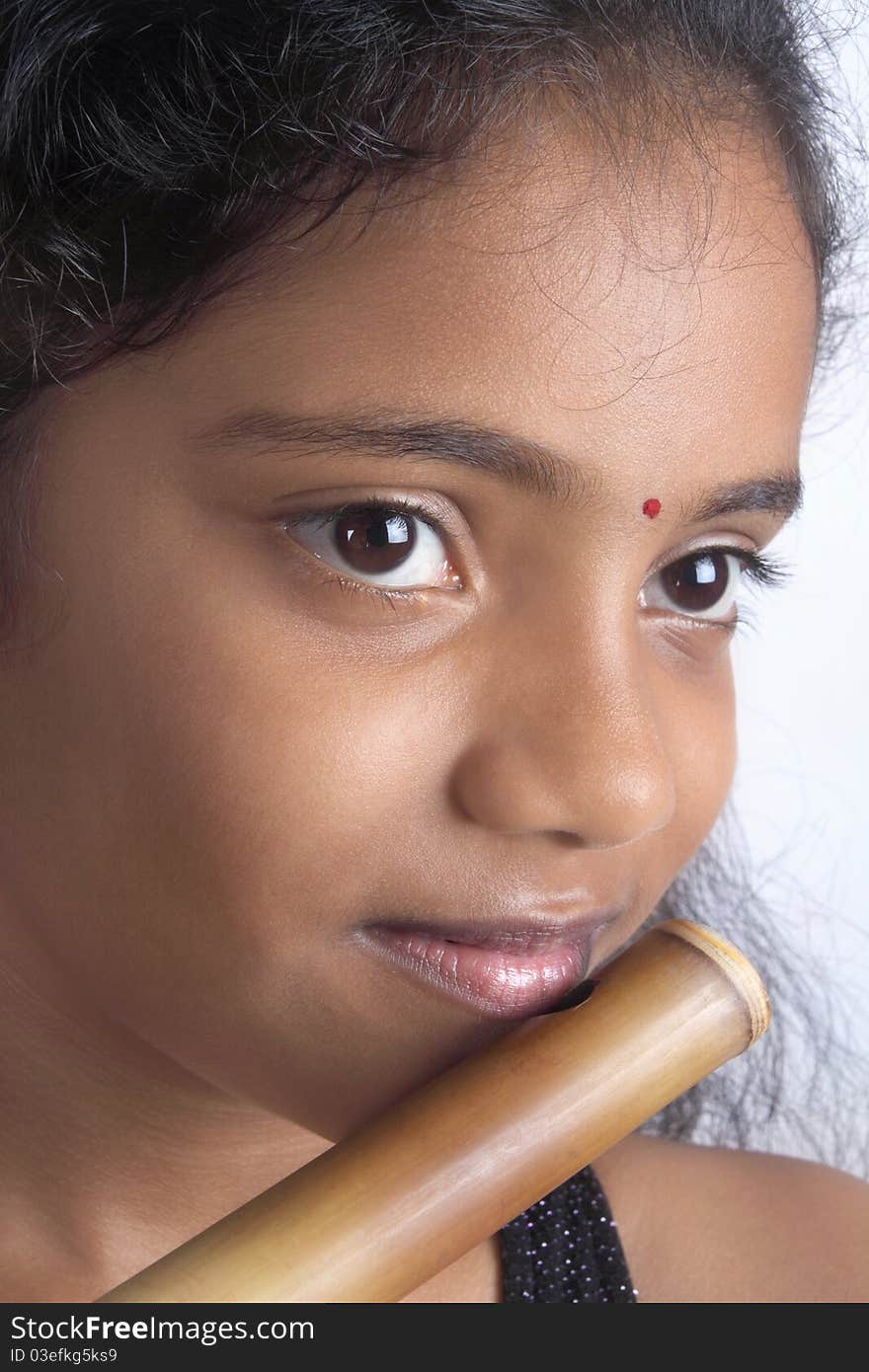 Indian Teenage Girl With Flute