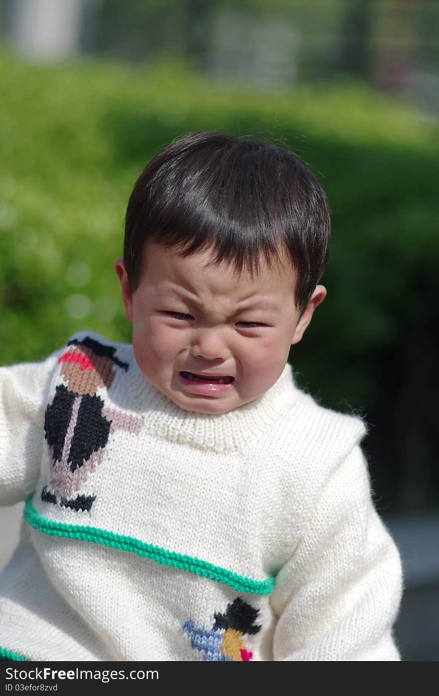 A little crying girl of chinese