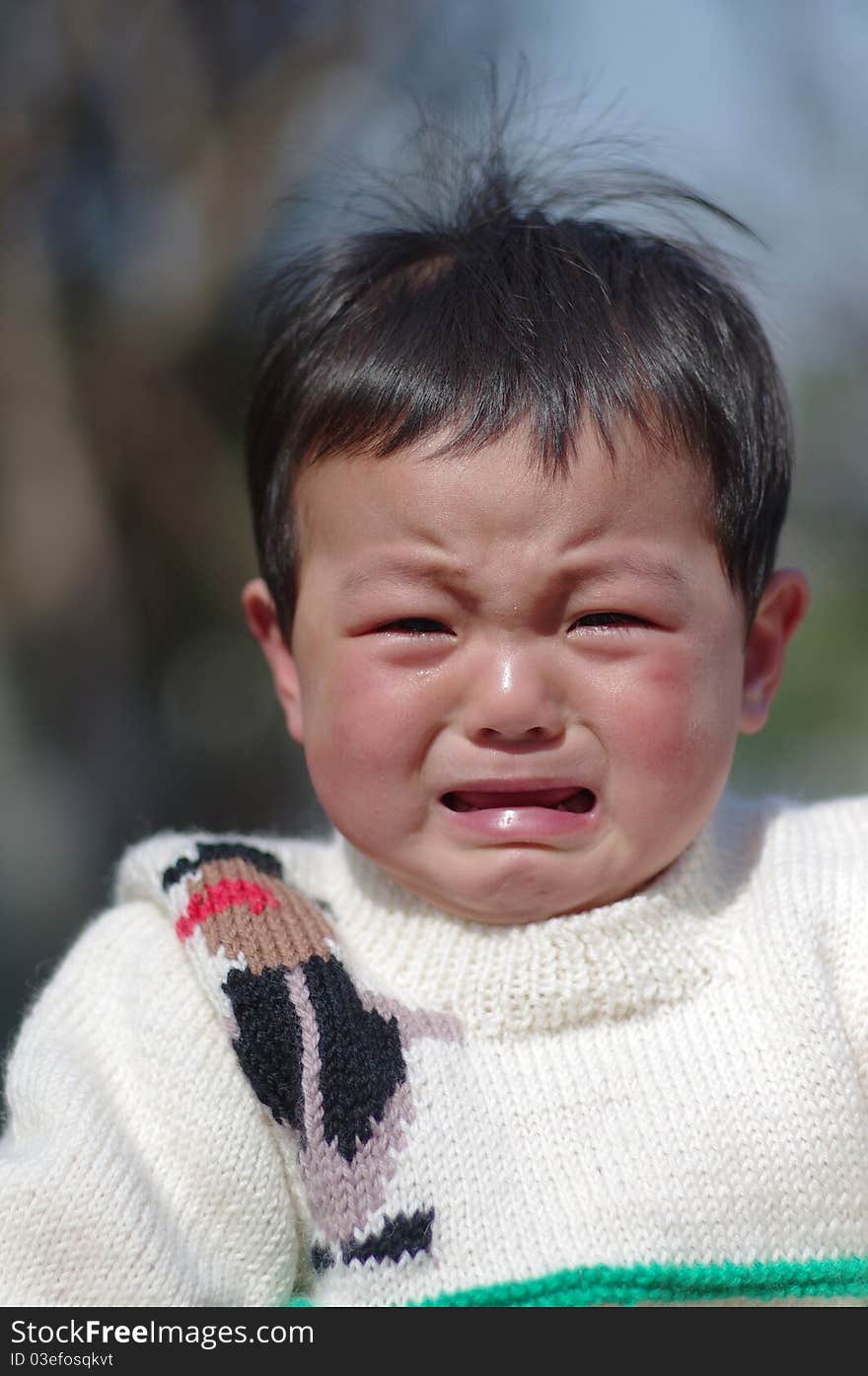 A little crying girl of chinese