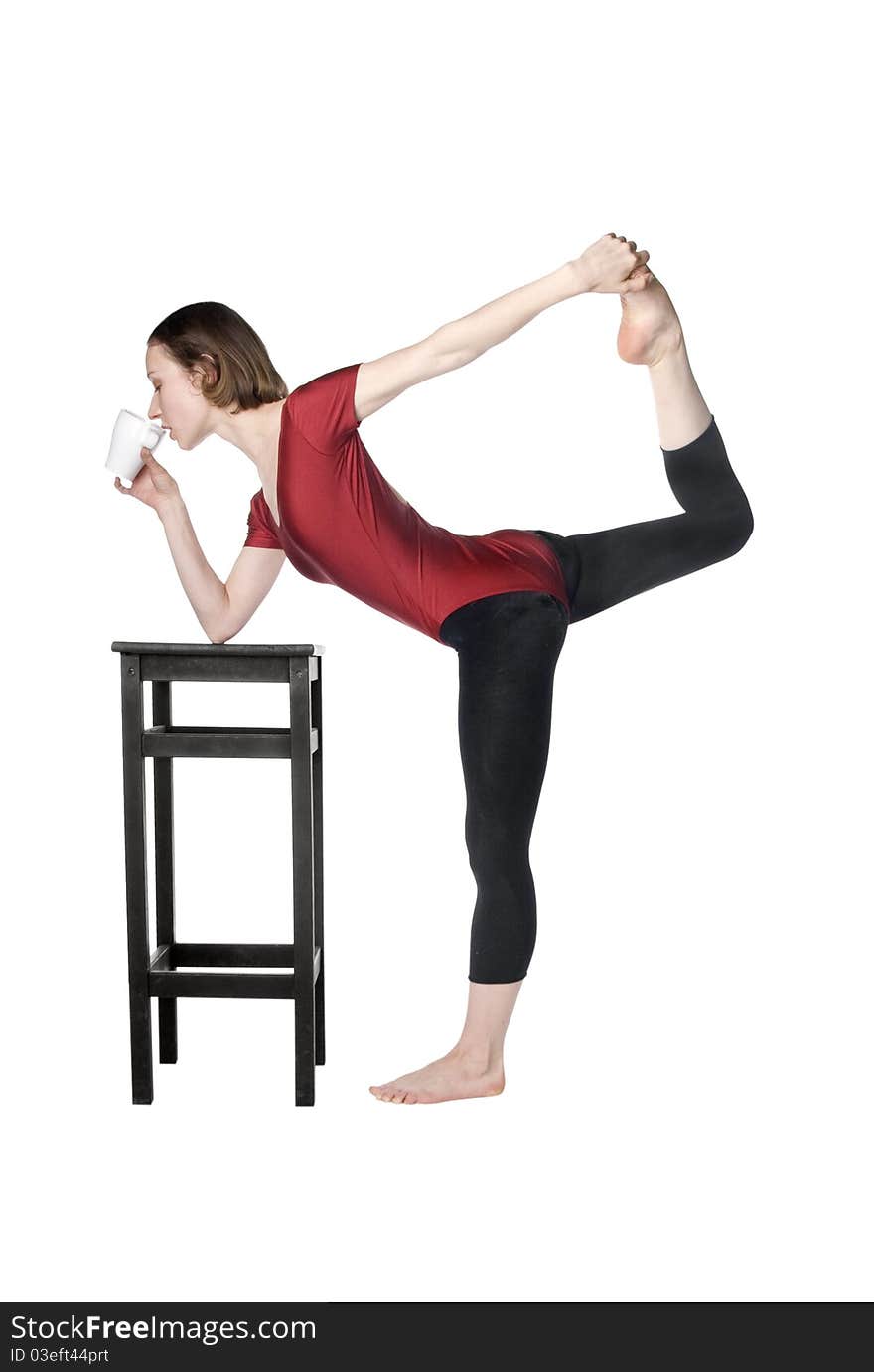 Slim woman drinking tea and stretching at the same time. Slim woman drinking tea and stretching at the same time