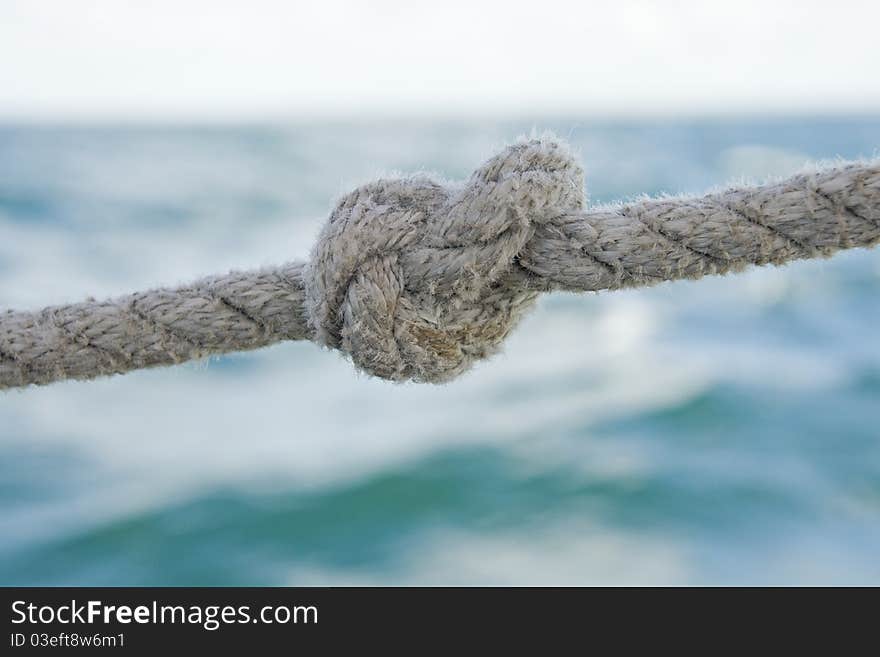 Knot on a rope against sea water