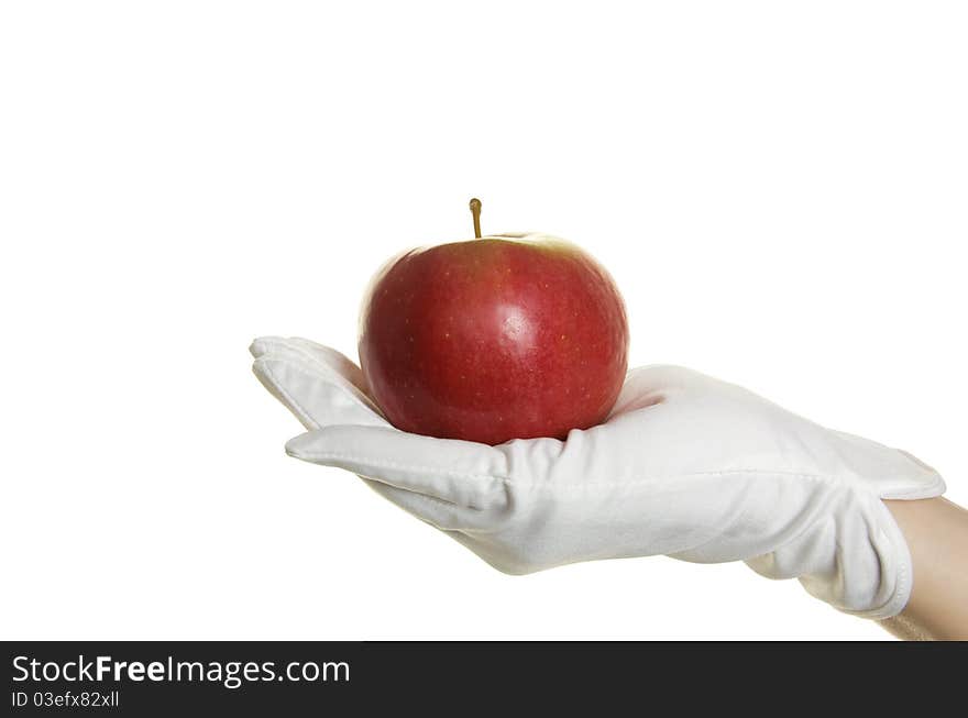 Human hand in glove with apple isolated over white. Human hand in glove with apple isolated over white
