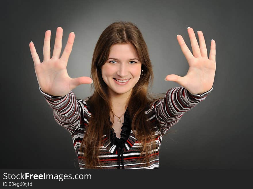 Portrait of pretty woman pointing at you with both hands