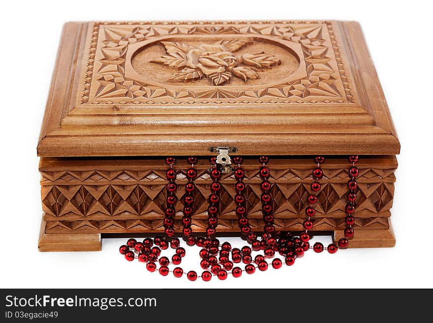 A beautiful wooden box and the beads isolated on white background. A beautiful wooden box and the beads isolated on white background