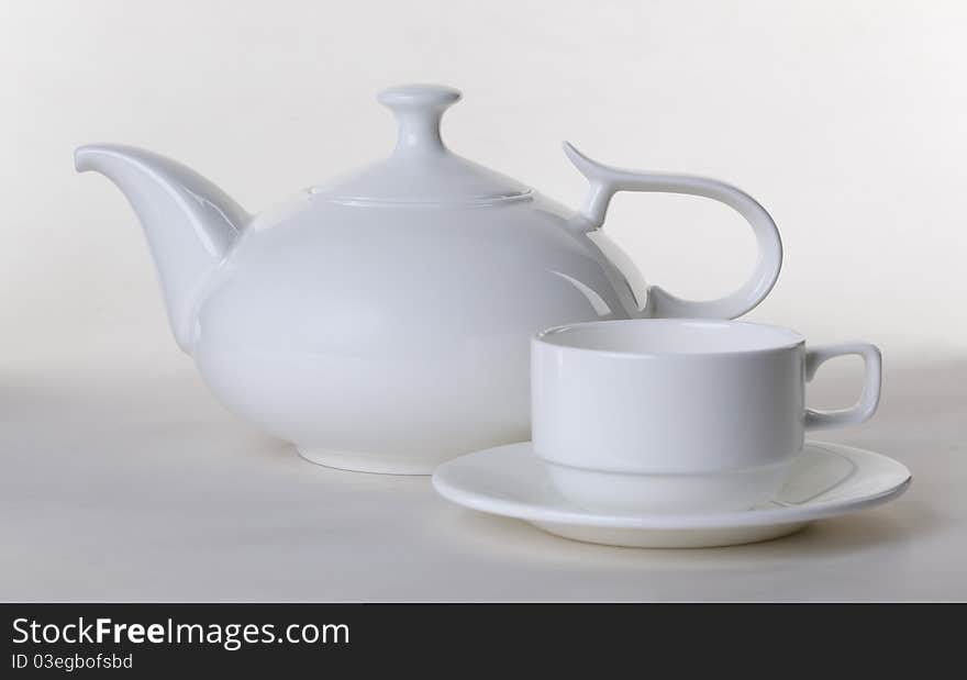 White teapot with a mug