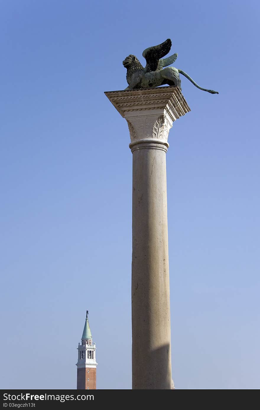 Winged lion on the column in venice against the sky