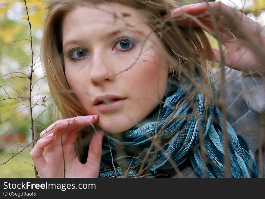 The girl looked through the branches. The girl looked through the branches