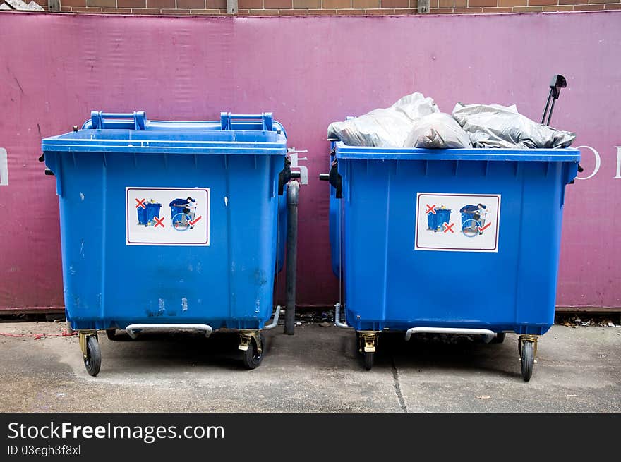 Two garbage trash on public street. Two garbage trash on public street