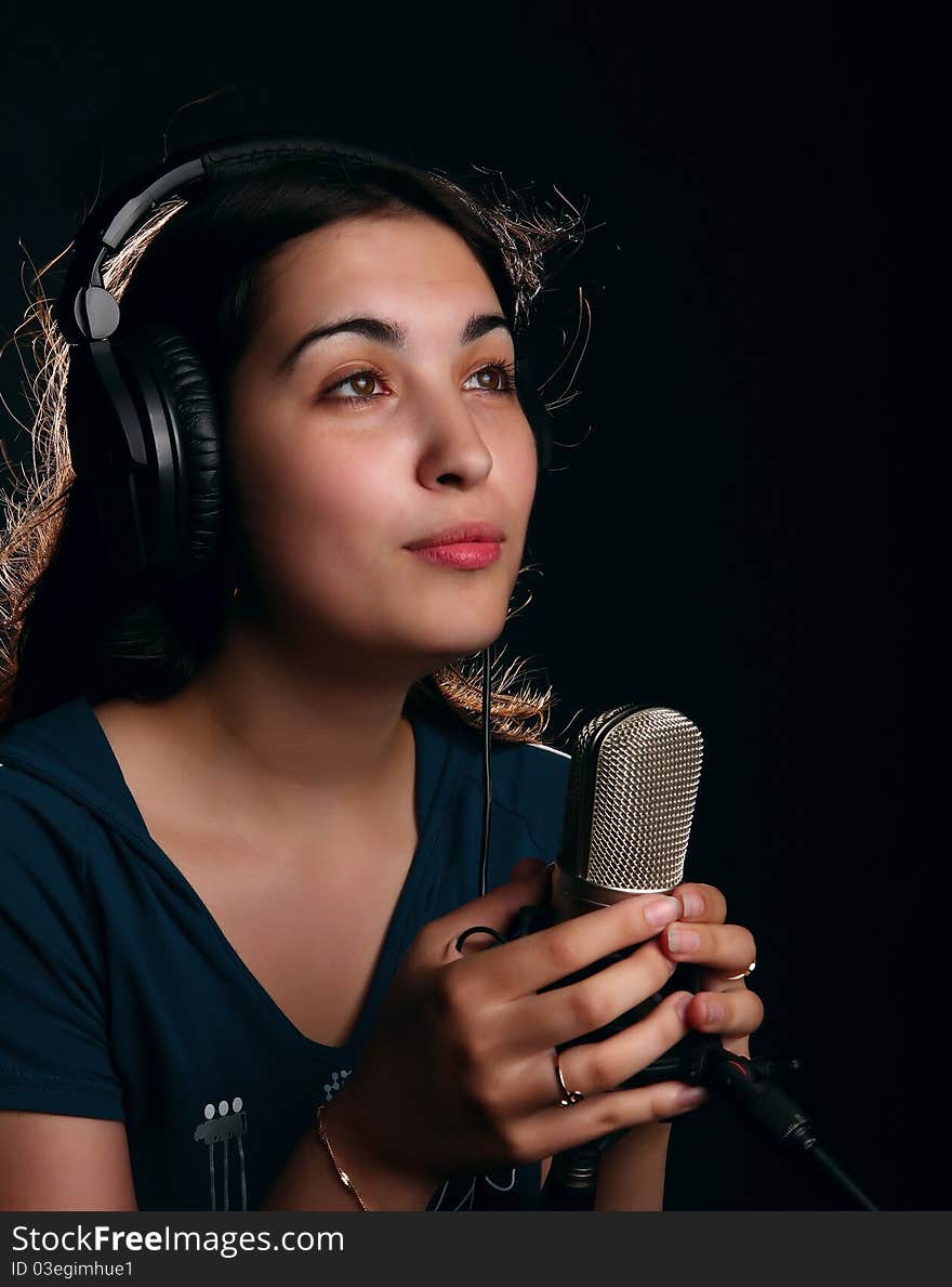 Girl with a microphone and head-phones