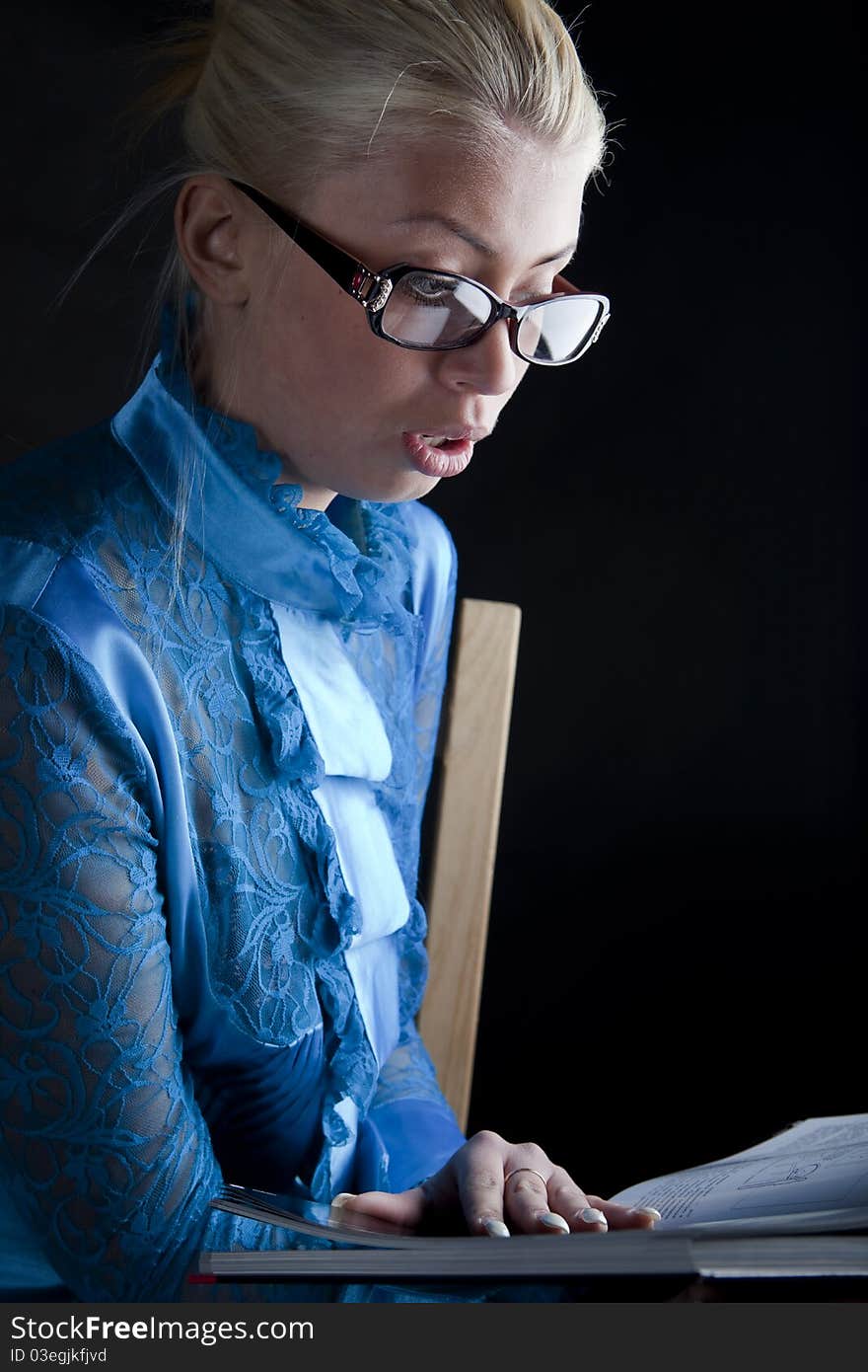 Closeup of beautiful girl holding a book