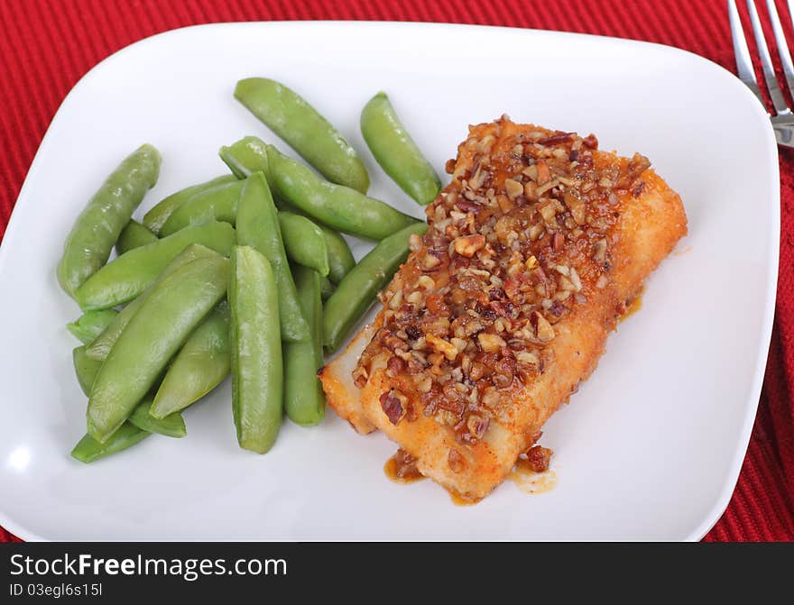 Fried cod fish fillet with snap peas. Fried cod fish fillet with snap peas