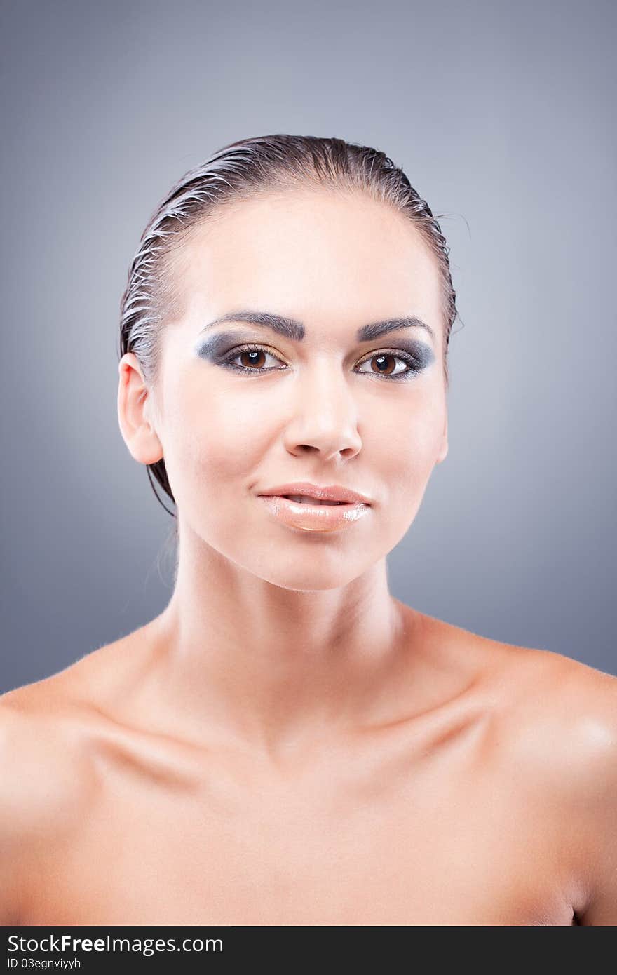 Satisfied smiling brunette woman looking at camera