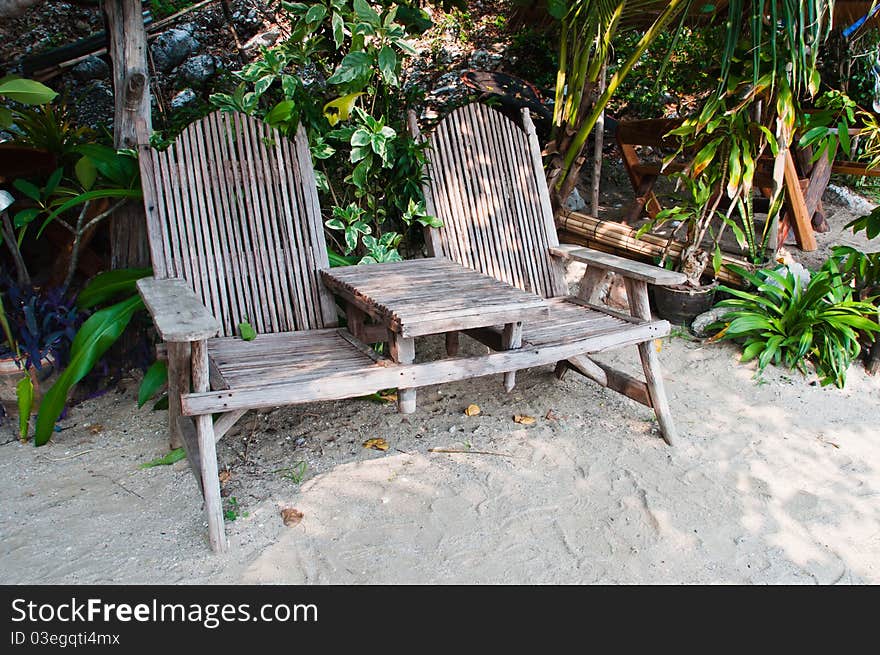 Wooden chair on the sand