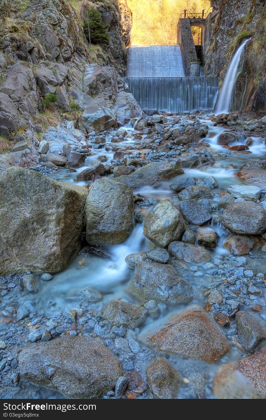 Cimbergo’s falls, created by the artificial lake of an hydroelectric power station, Brixia province, Lombardy region, Italy.