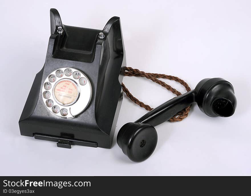 An old dial type 1940-50s bakelite telephone. An old dial type 1940-50s bakelite telephone.