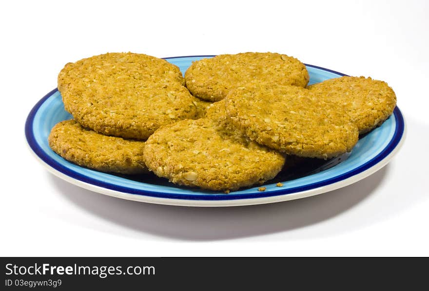 A close up of plain cookies on a blue plate. A close up of plain cookies on a blue plate