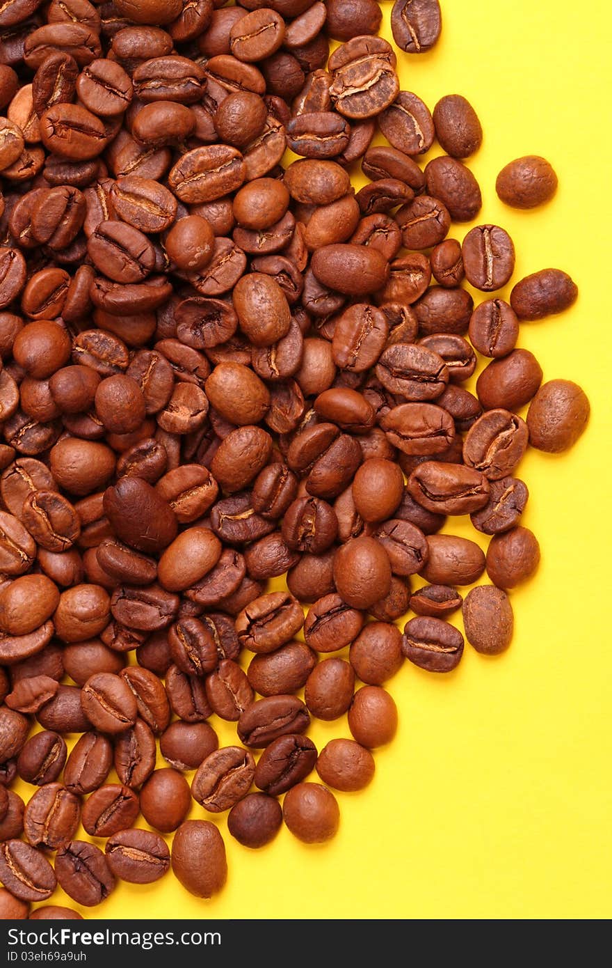 Coffee beans on a yellow background