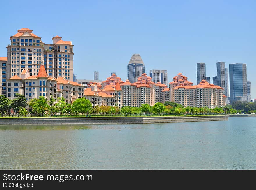 Apartments and buildings by the river at Kallang Basin, under the clear blue sky. Apartments and buildings by the river at Kallang Basin, under the clear blue sky