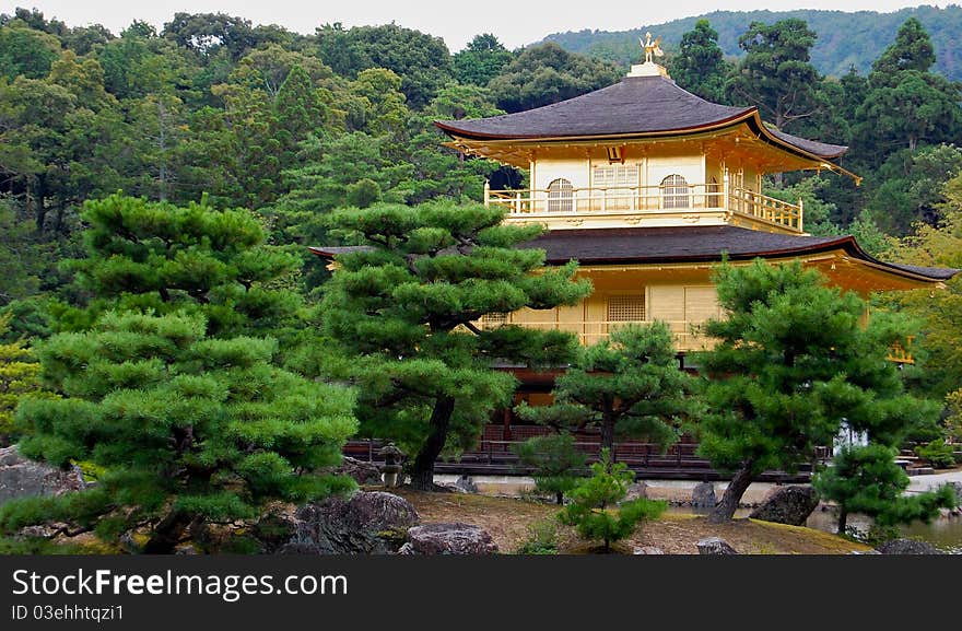 The most popular shrine in Kyoto, Japan: the Golden Temple, also known as Kinkaku-ji. The building is covered in real gold leaf and surrounded by lush gardens. The most popular shrine in Kyoto, Japan: the Golden Temple, also known as Kinkaku-ji. The building is covered in real gold leaf and surrounded by lush gardens.