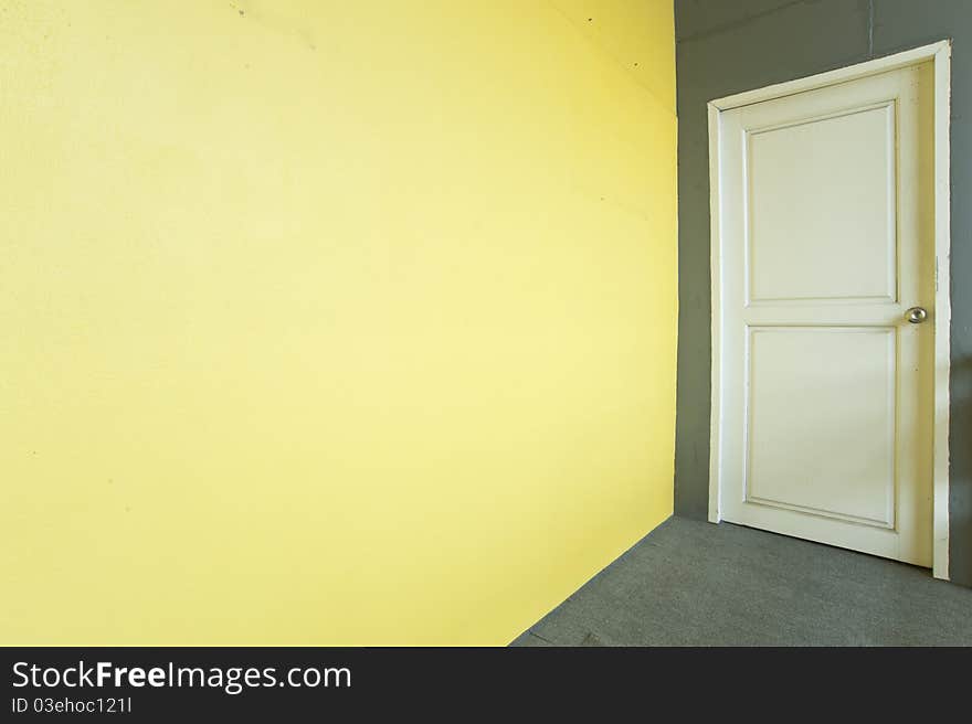 White door and yellow wall