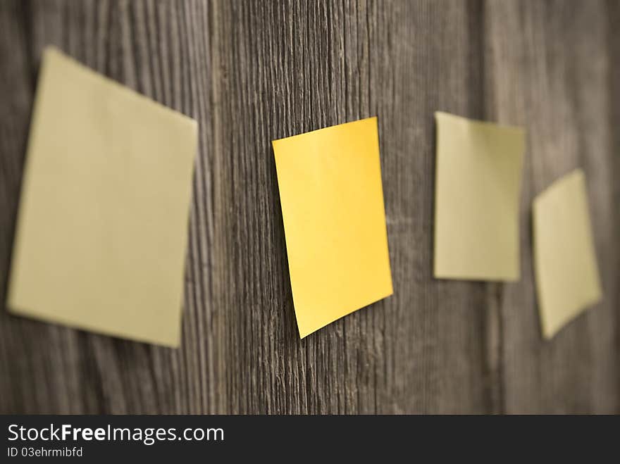 Yellow sheets on a wooden fence