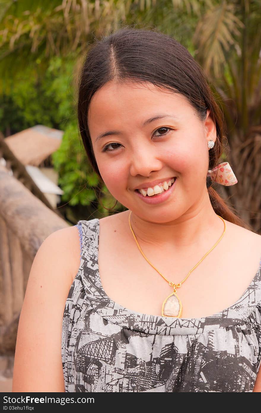 Young thai woman smiling in the park