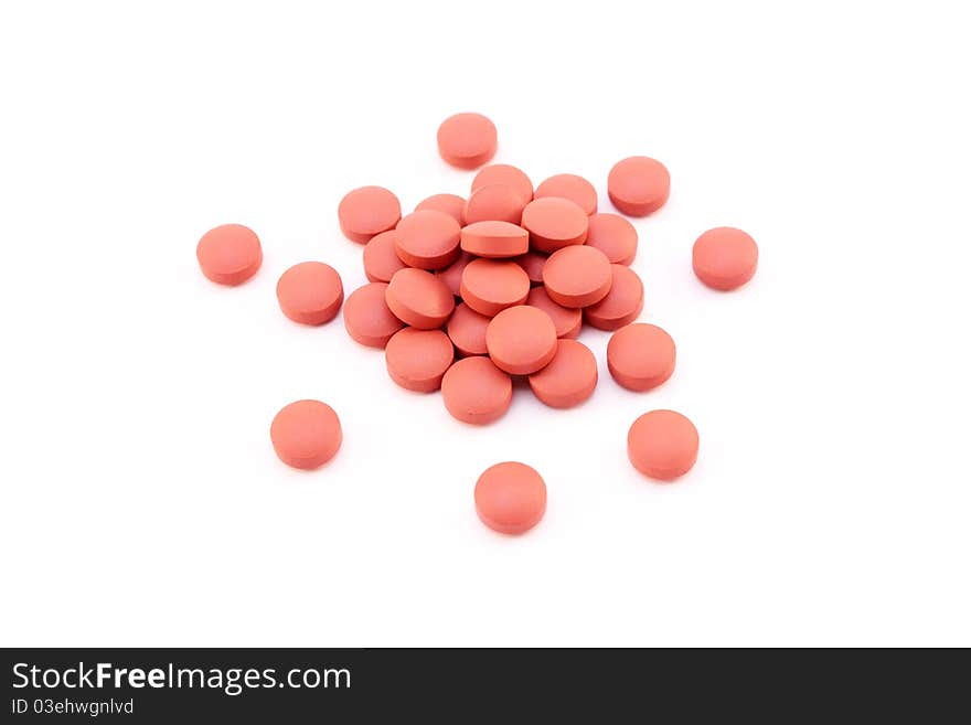 Small pile of pills isolated over white background