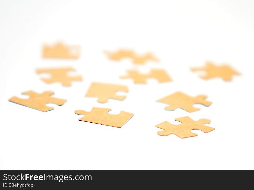 Cardboard jigsaw puzzle isolated on white background