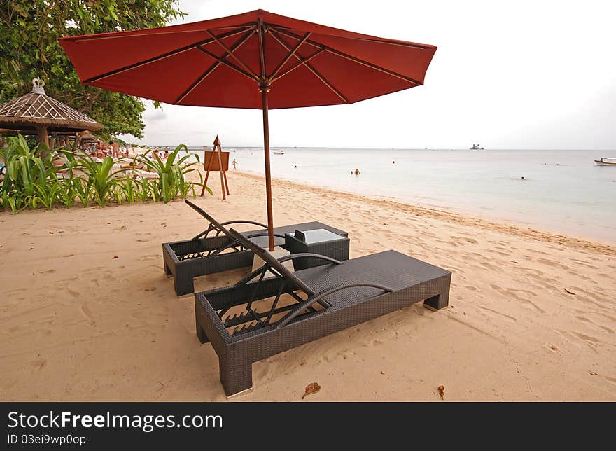 Two chairs and umbrella on the beach