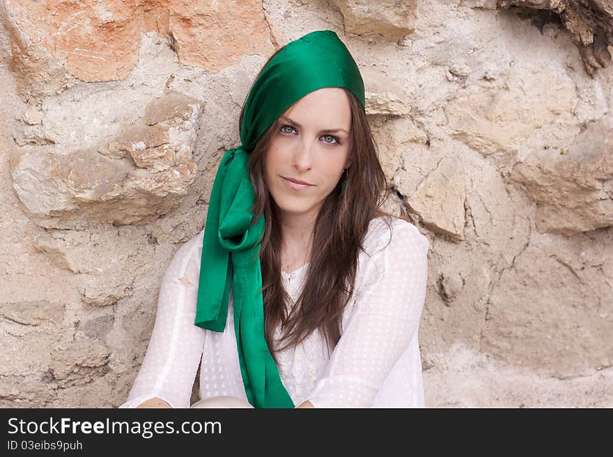 Young attractive woman portraited infront of the wall. Young attractive woman portraited infront of the wall