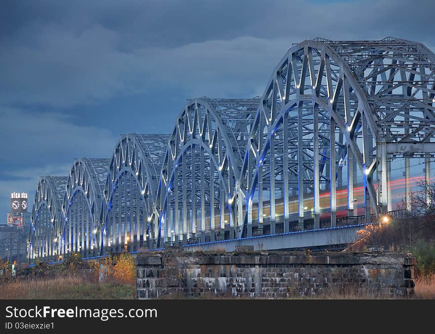 The railway riveted bridge across Daugava river in Riga, Latvia. The railway riveted bridge across Daugava river in Riga, Latvia.