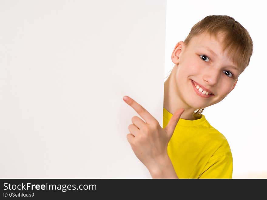 Smiling boy with a board on a white background