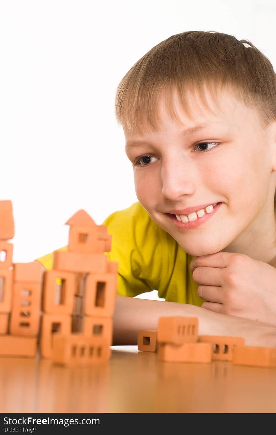 Young boy consctructing on a white background. Young boy consctructing on a white background