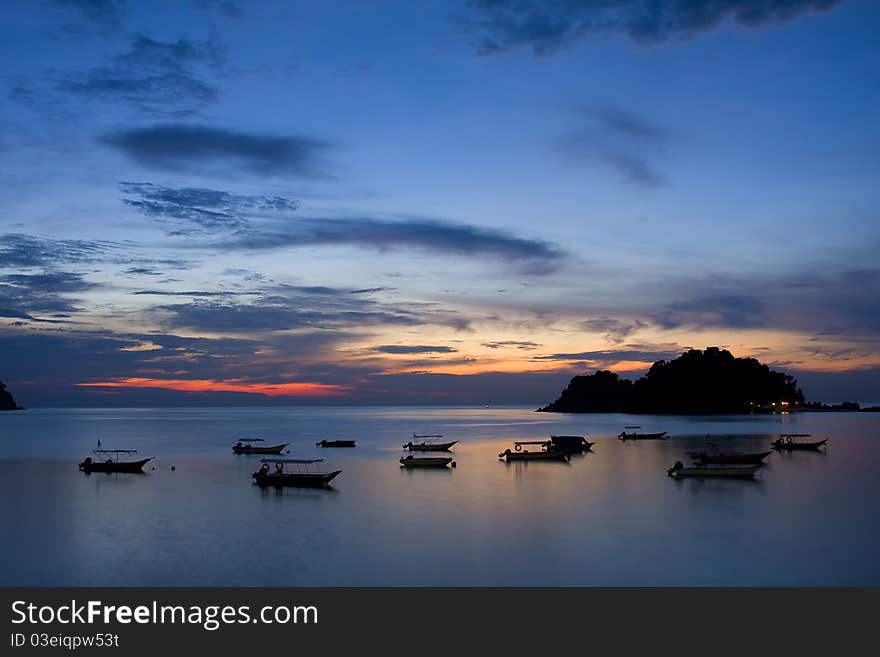 Seascape Sunset And Boat Silhouette