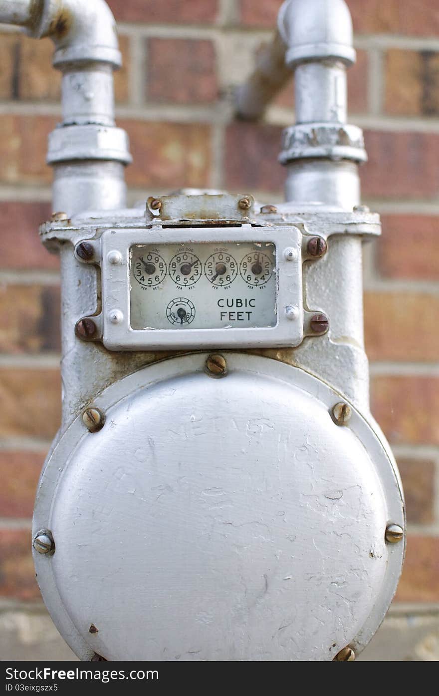 A water meter shines on the exterior of a suburban home. A water meter shines on the exterior of a suburban home.