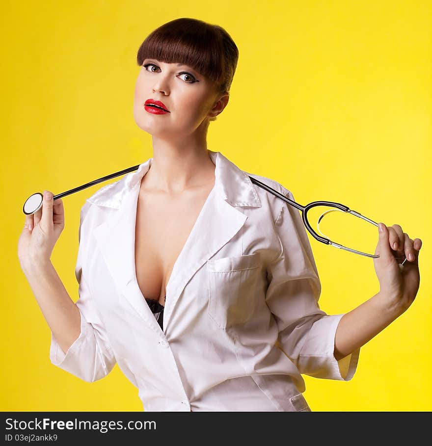 Attractive woman in nurse costume with stethoscope look at you. Attractive woman in nurse costume with stethoscope look at you