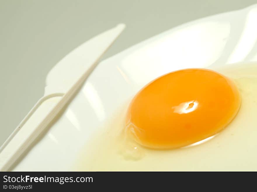 Whites and yolk on white plate. Whites and yolk on white plate