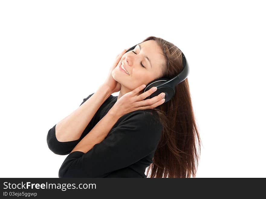 Brunette woman listen and enjoy the relax music in headphones, smiling, laughing and not looking in camera isolated on a white background. Brunette woman listen and enjoy the relax music in headphones, smiling, laughing and not looking in camera isolated on a white background