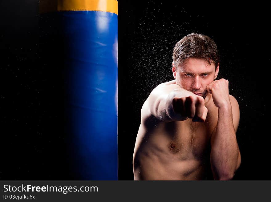 Athlete trains with boxing projectile