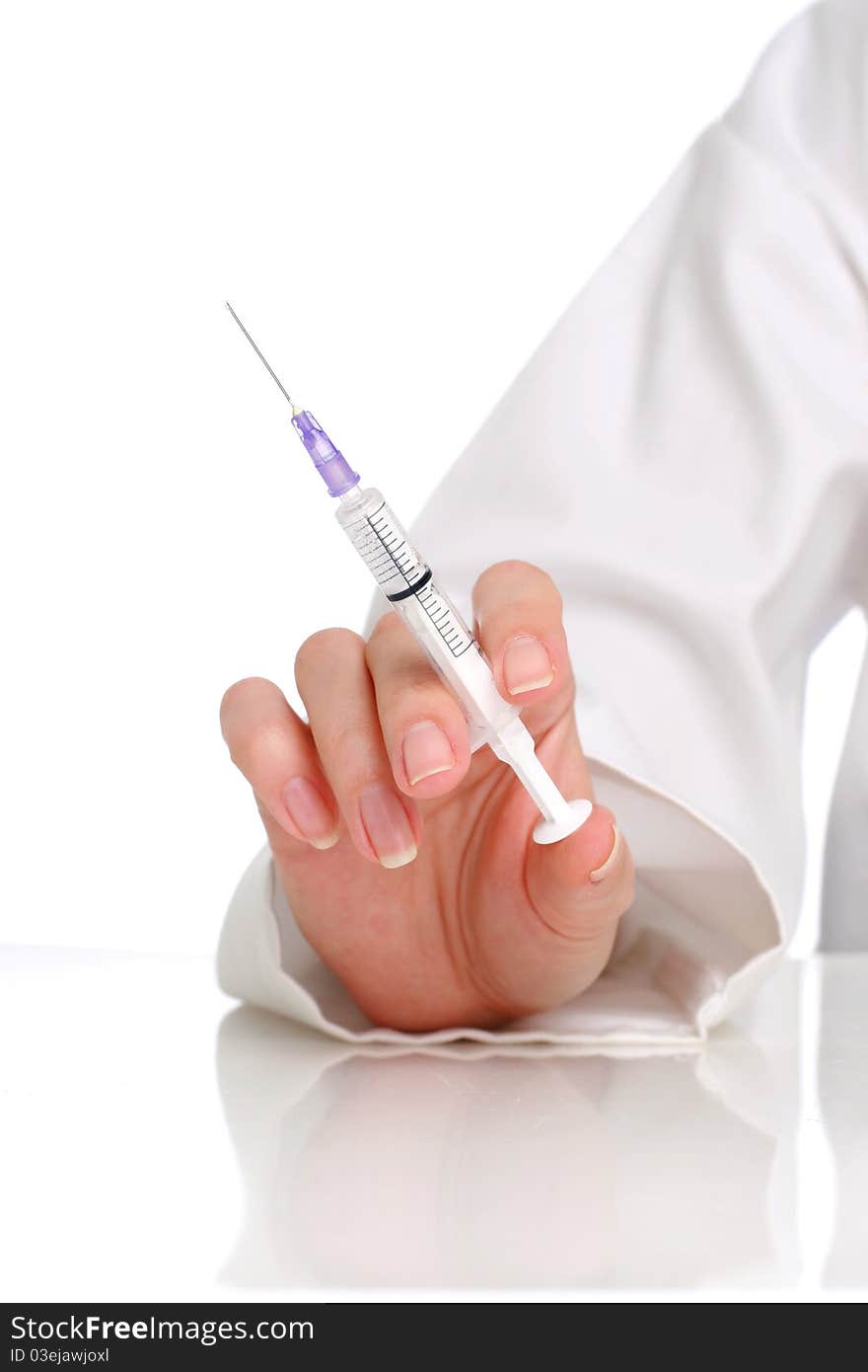 Doctor. Syringe in the hand isolated over white background. Doctor. Syringe in the hand isolated over white background.