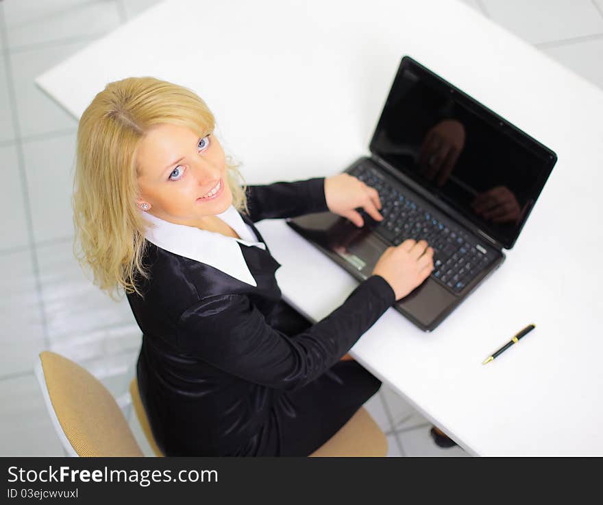 Businesswoman Working  On The Laptop In The Office